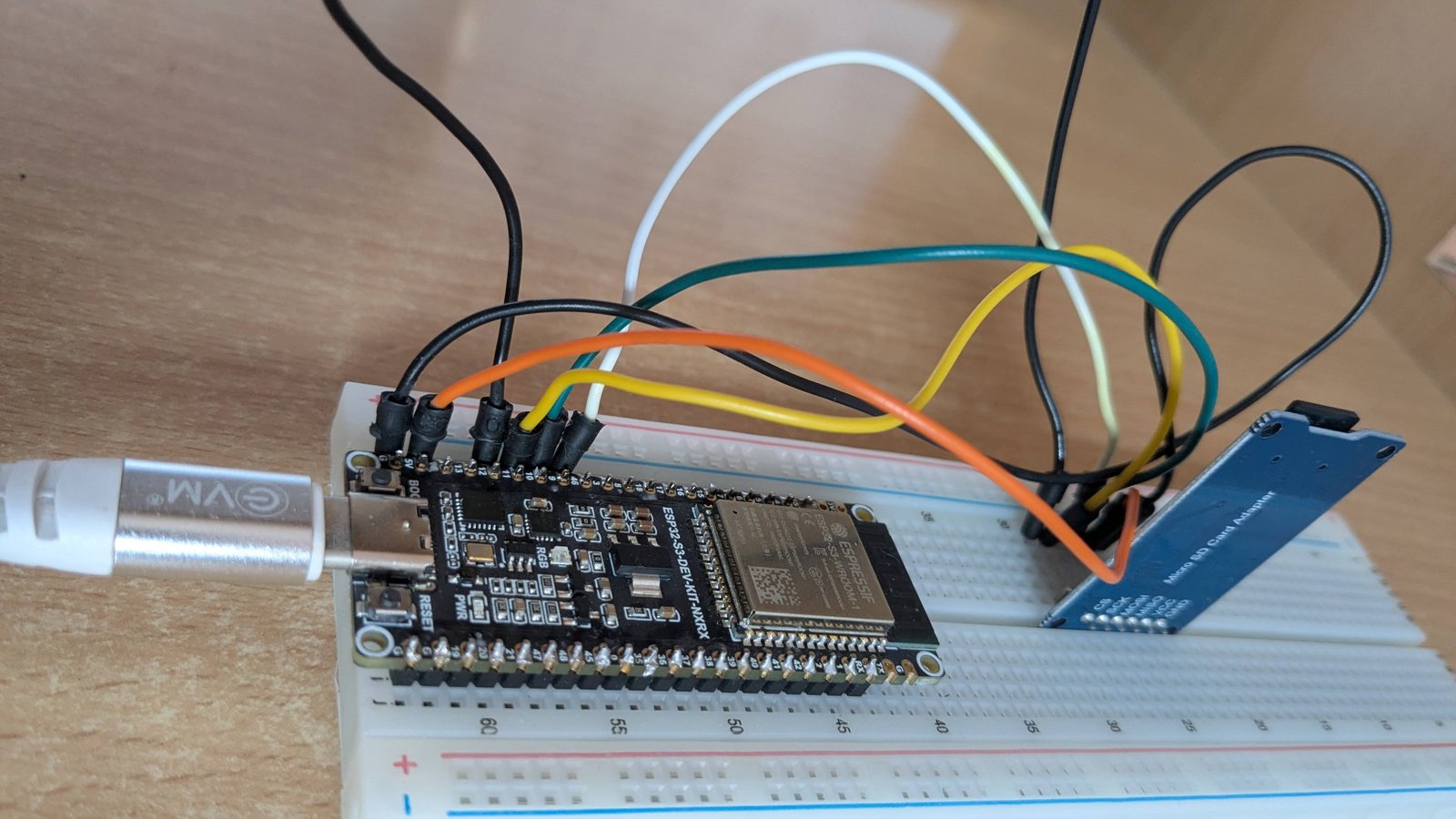 ESP32-S3 dev kit wired to an external HW-125 SD card module on a breadboard